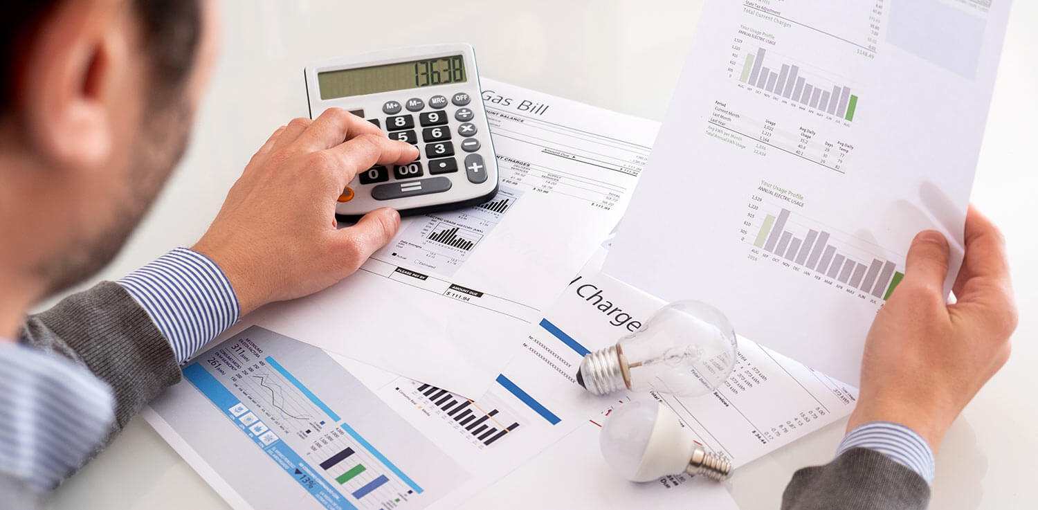 Man calculating energy expenses 