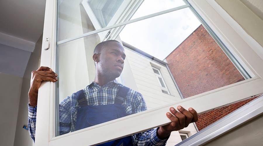 Man installing insulated windows