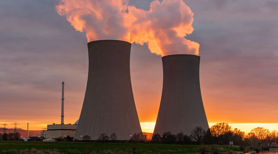 Nuclear power plant cooling towers at dusk