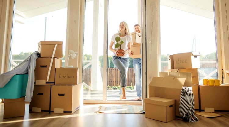Couple moving to Ohio in new house with boxes