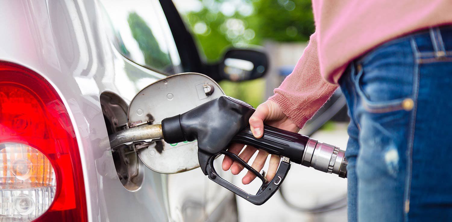 Filling up a car with gasoline fuel