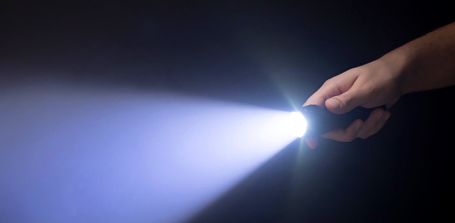 Shining an LED flashlight during a power outage