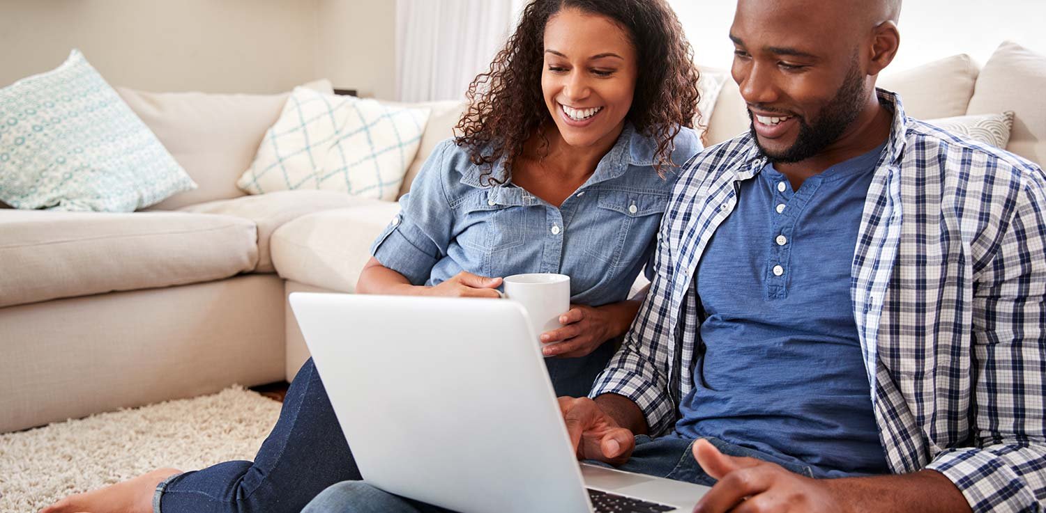 Young couple learning how to set up utilities in their new home, and how to shop for the best electric rate