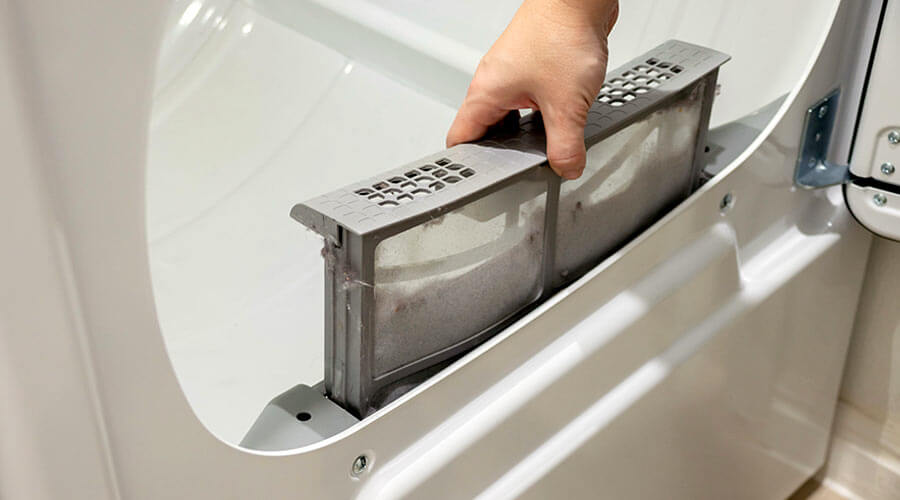 removing lint from dryer lint tray