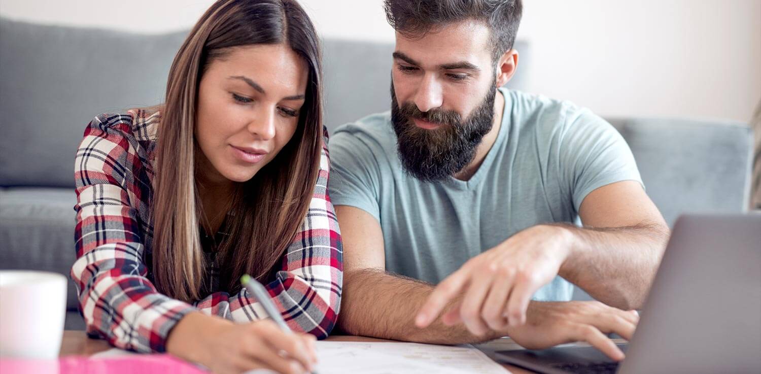 Man and woman researching their best electric rate