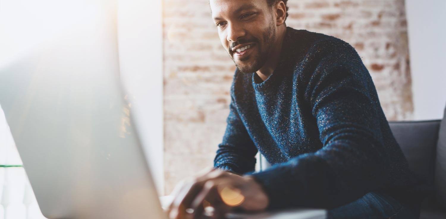 Man typing on computer