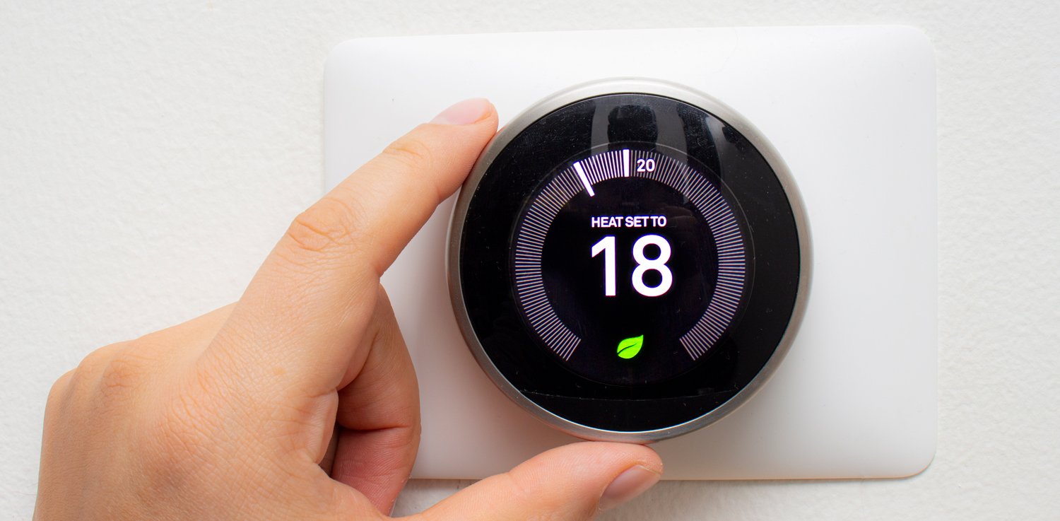 hand adjusting smart thermostat