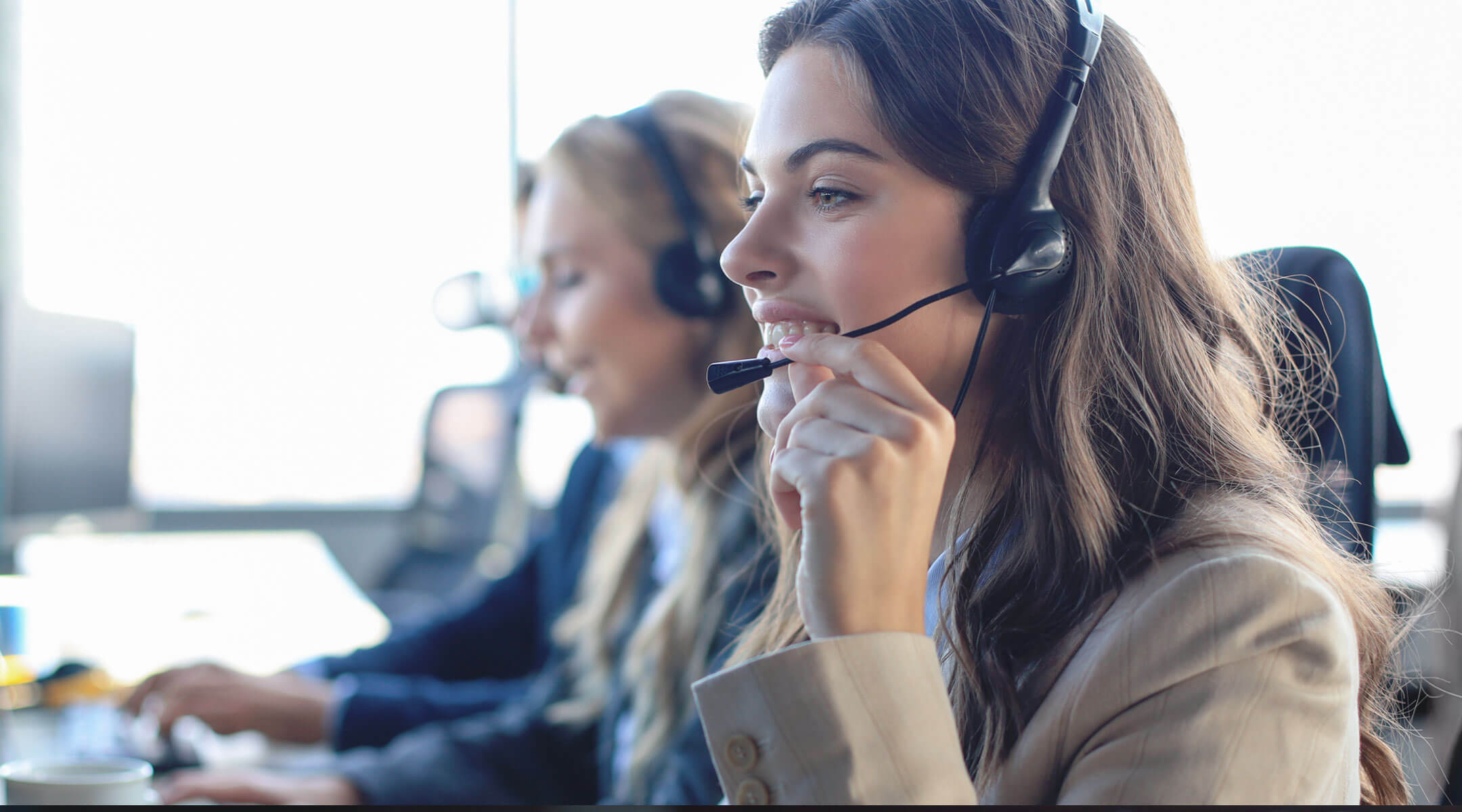 A call center customer service representative talking to a customer. 