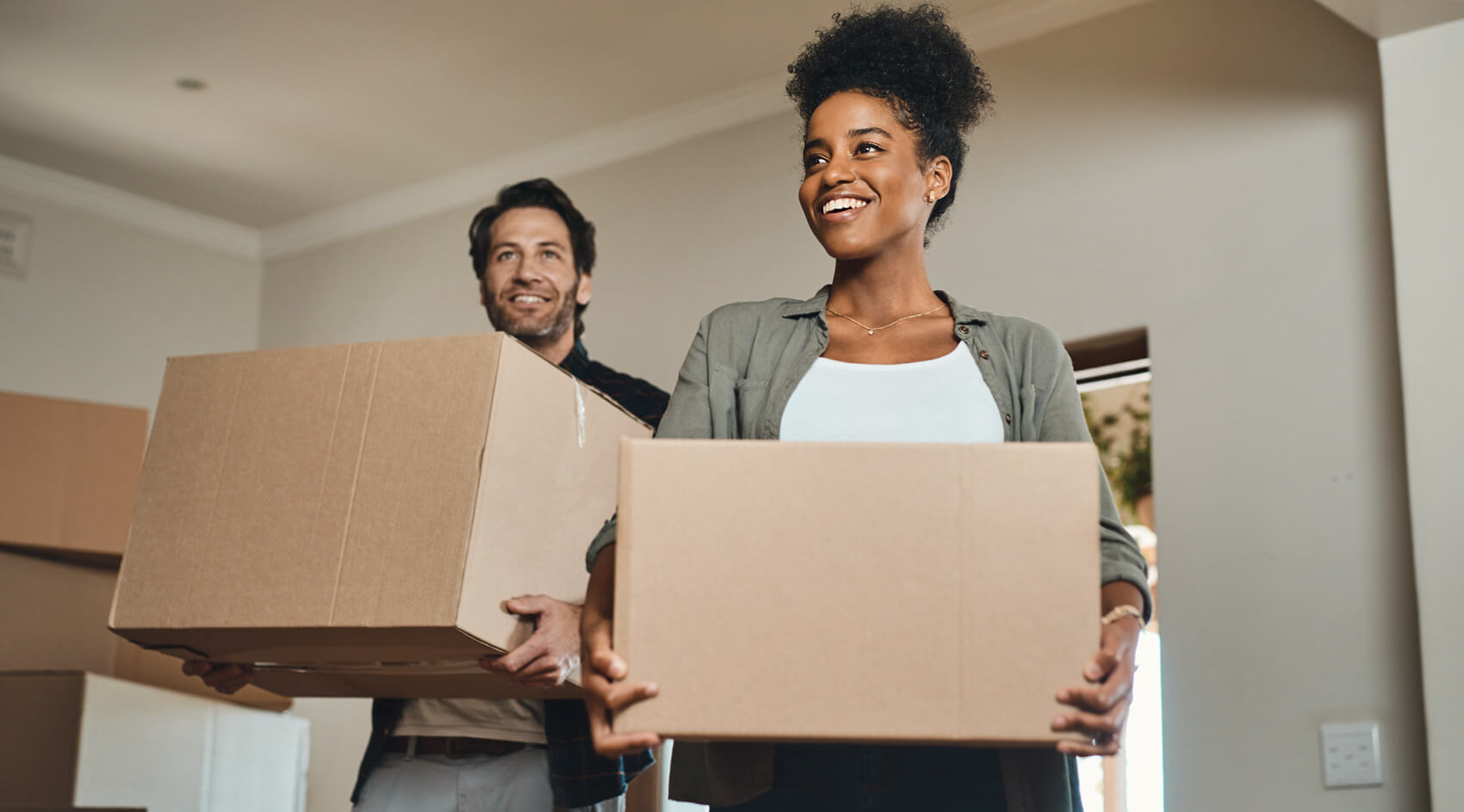 A young couple moves into their new home