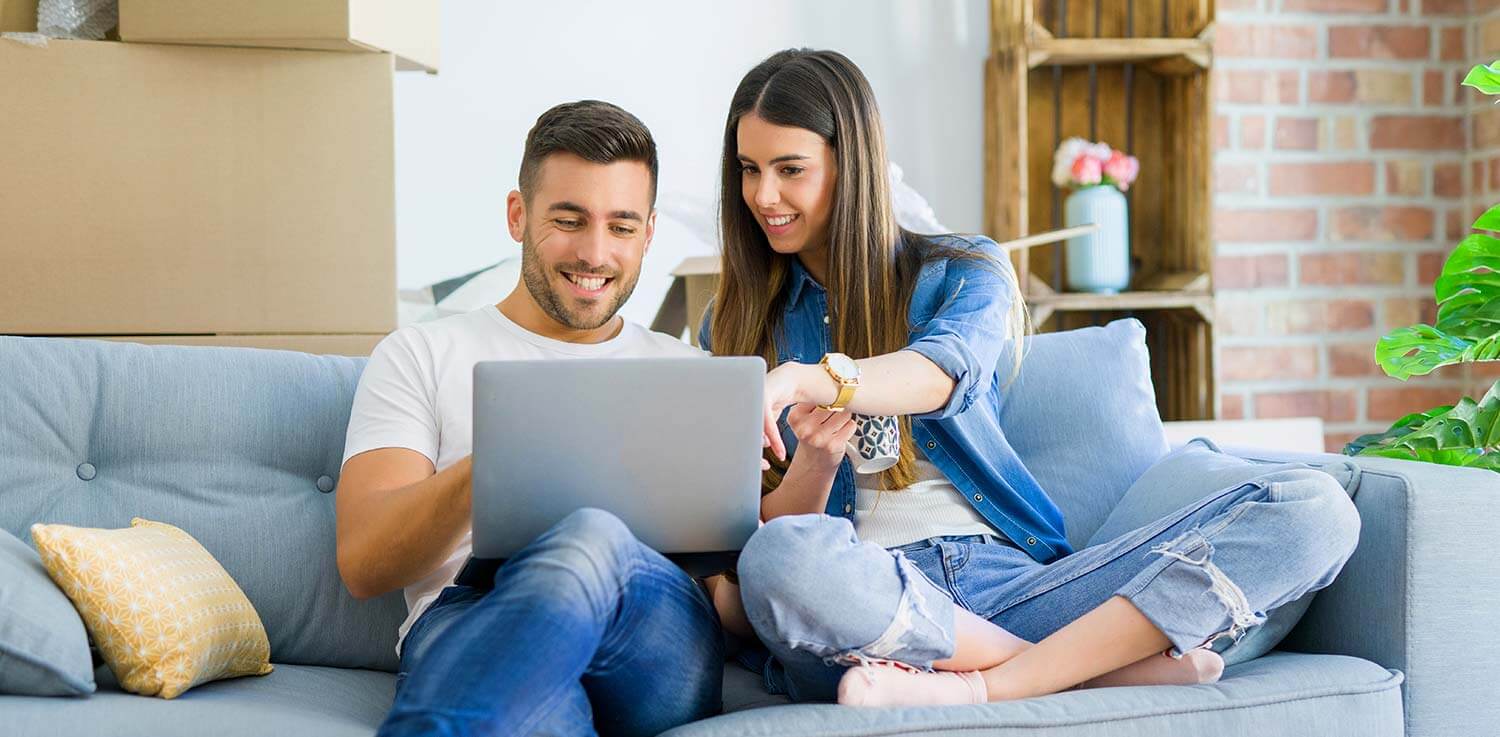 Couple looking at Philadelphia electric bill on laptop