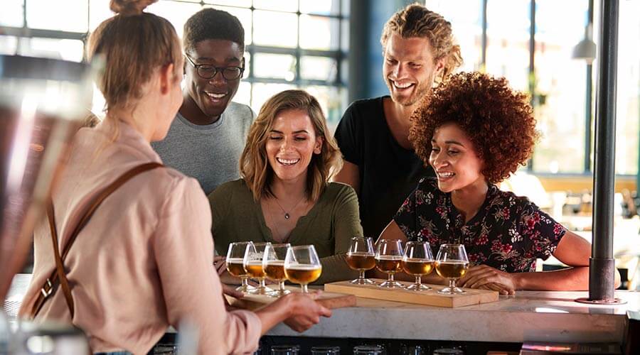 Friends having a drink at Pittsburgh brewery