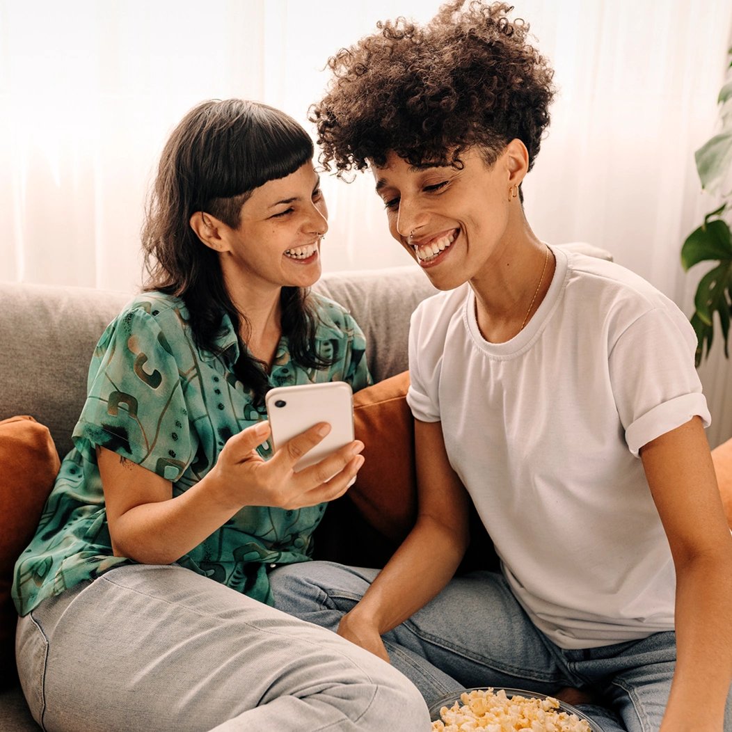 A young couple uses a tablet to go over estate planning options.