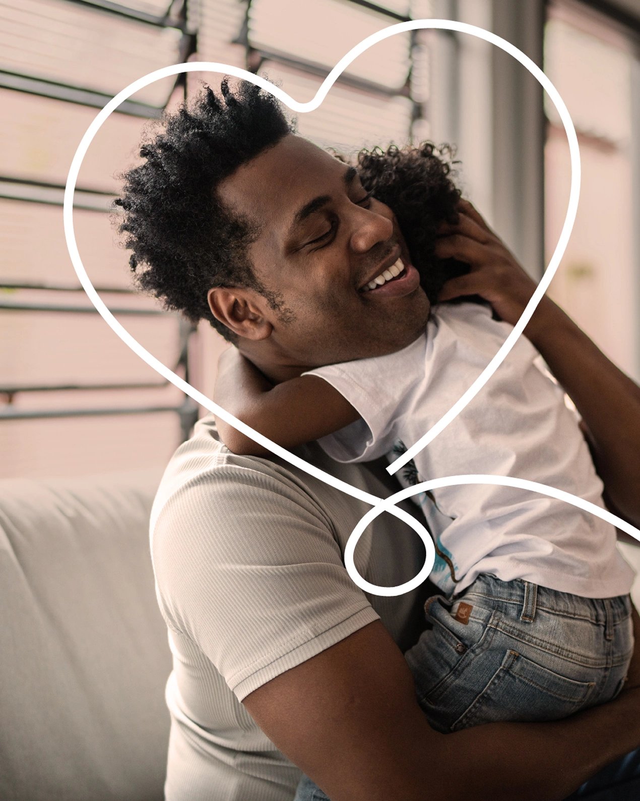 Young father hugs his toddler affectionately after purchasing term life insurance.
