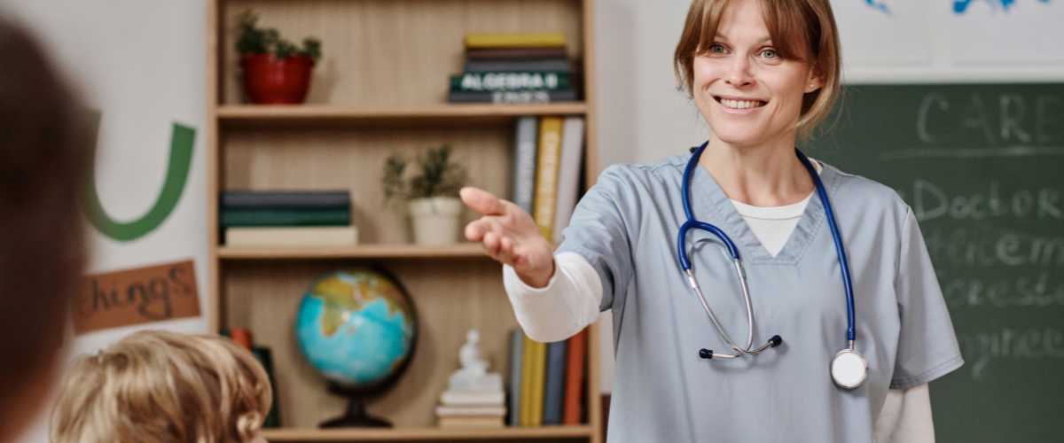 A doctor talking to a class on career day