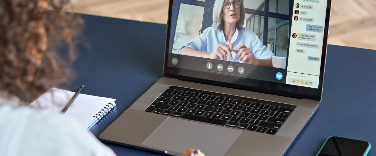 student on laptop in virtual meeting