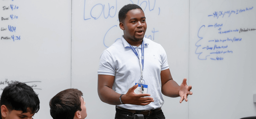 Student presenting in front of the class