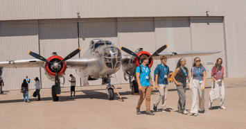 Aviation Academy students with a plane