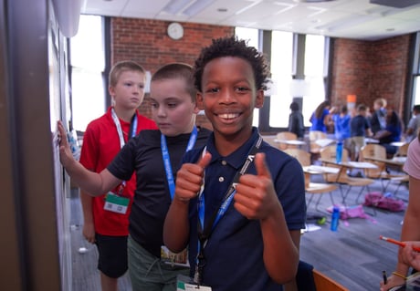 Student giving a thumbs up