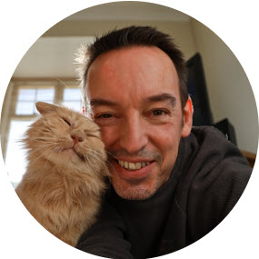 Smiling man with a cat