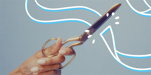 Scissors cutting ribbon