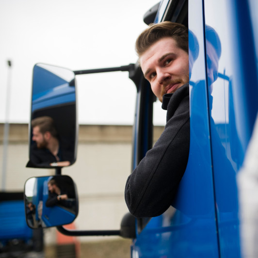 man-in-truck-looking-back