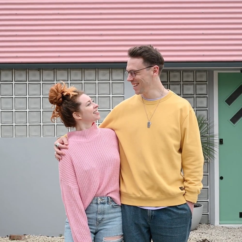Couple in front of a house