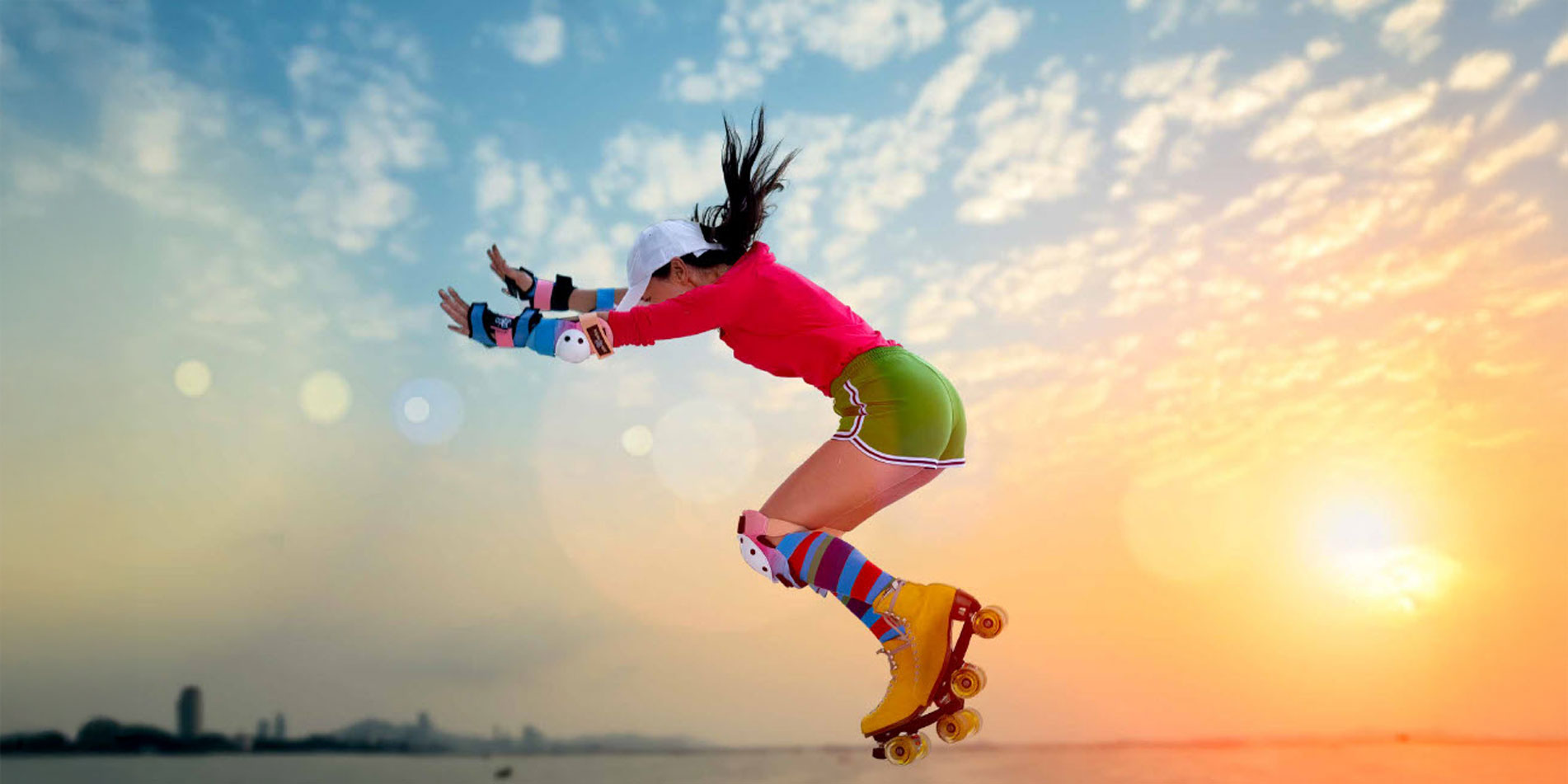 GIrl with roller skates jumping