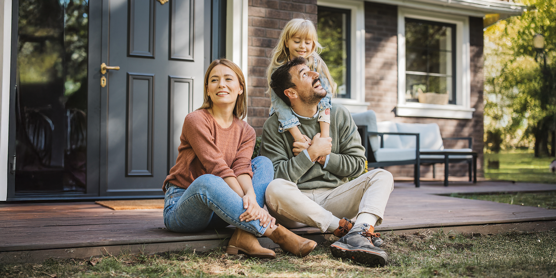 family of three on porch