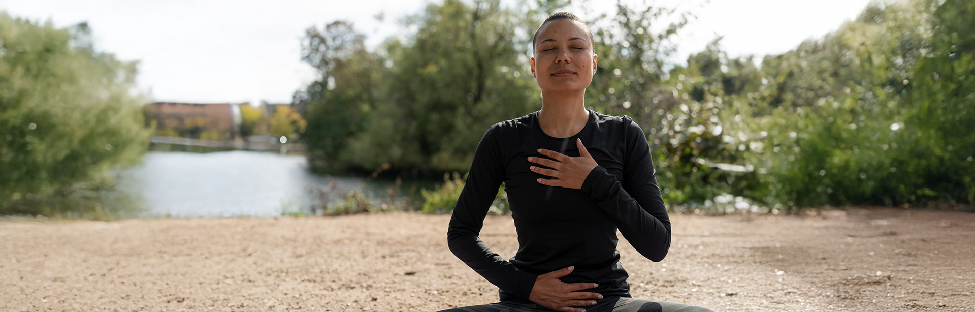 person meditating in nature