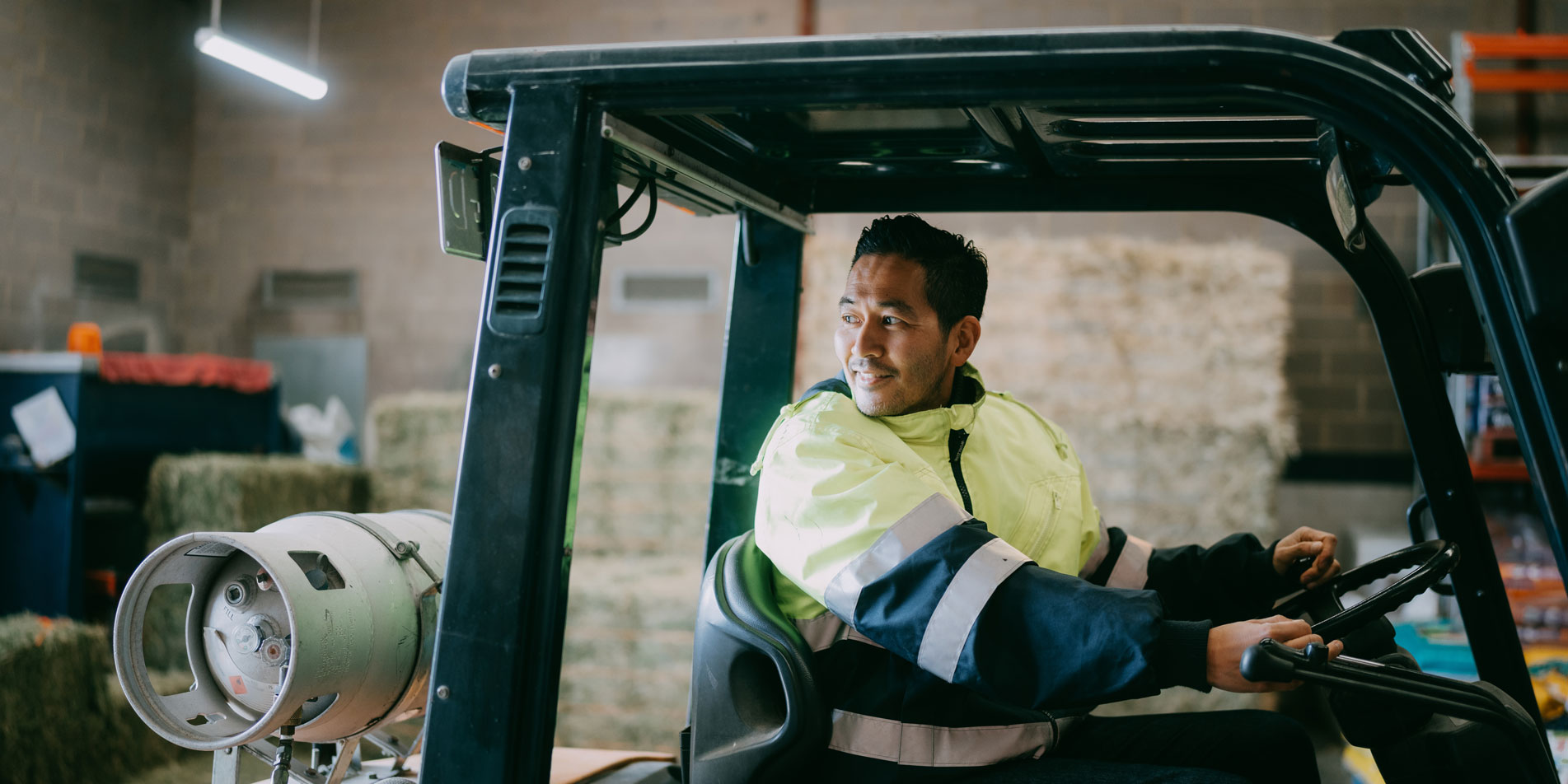 man driving forklift