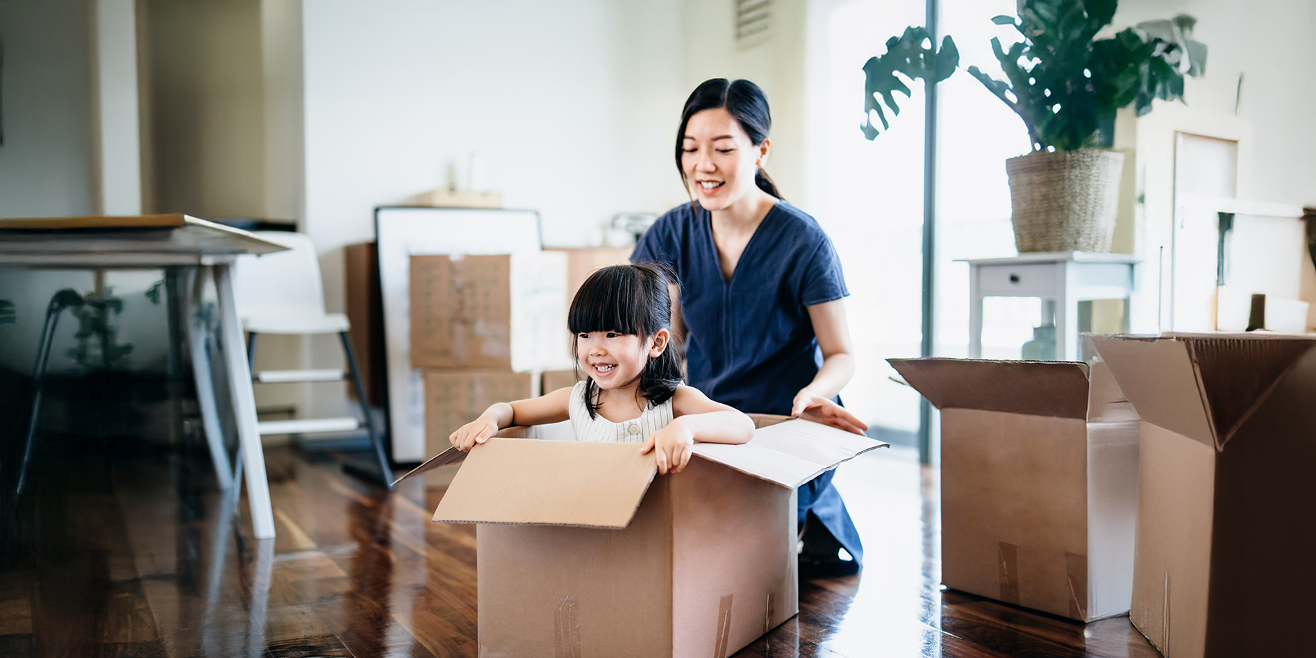 young girl in moving box