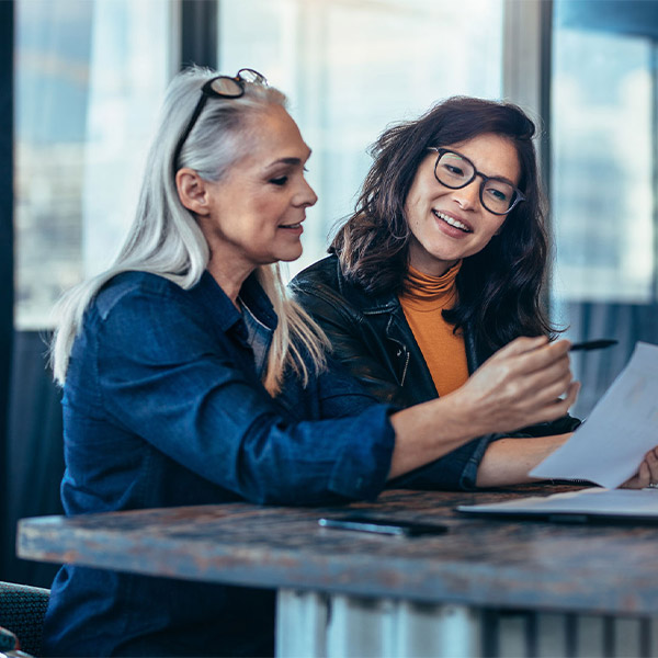 two women working together