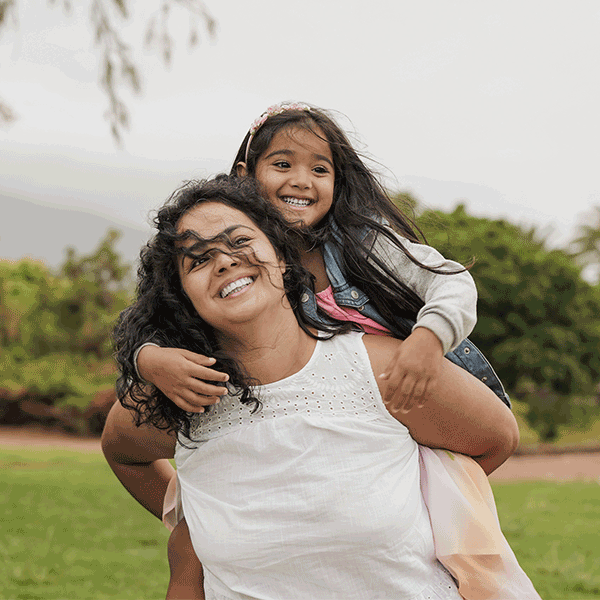 Happy mother and daughter at the park