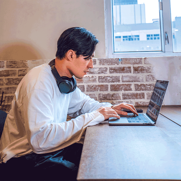 man working behind a computer