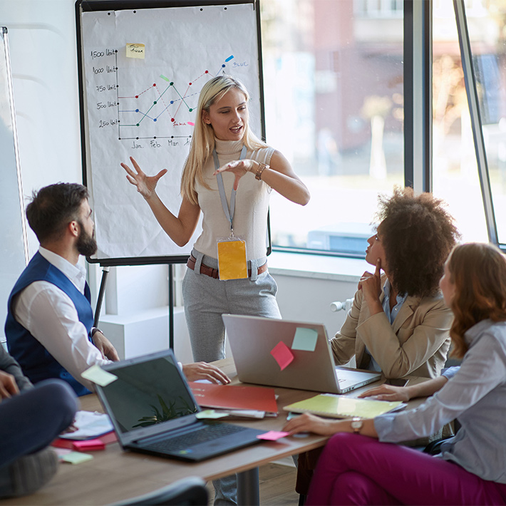 a group of people in a meeting