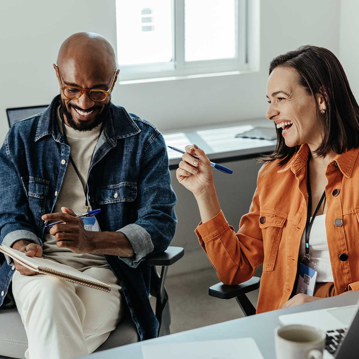business colleagues having a joyful discussion during an office meeting