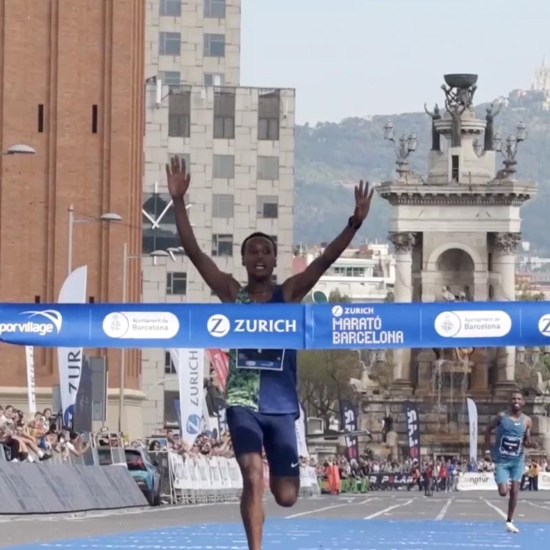 man finishing the Zurich Marato