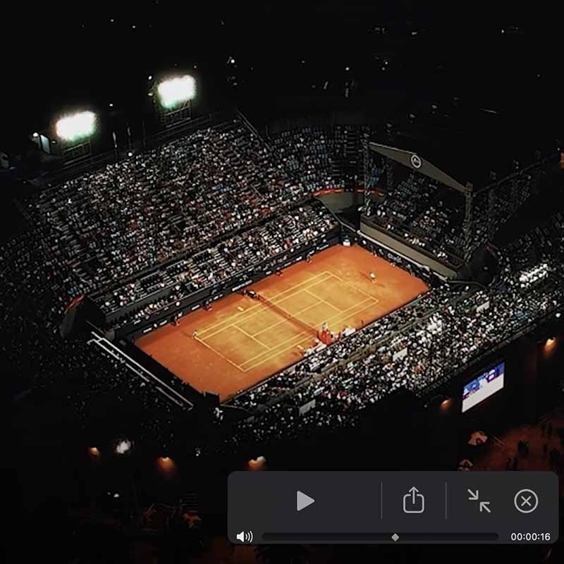 Center court of a tennis tournament by night