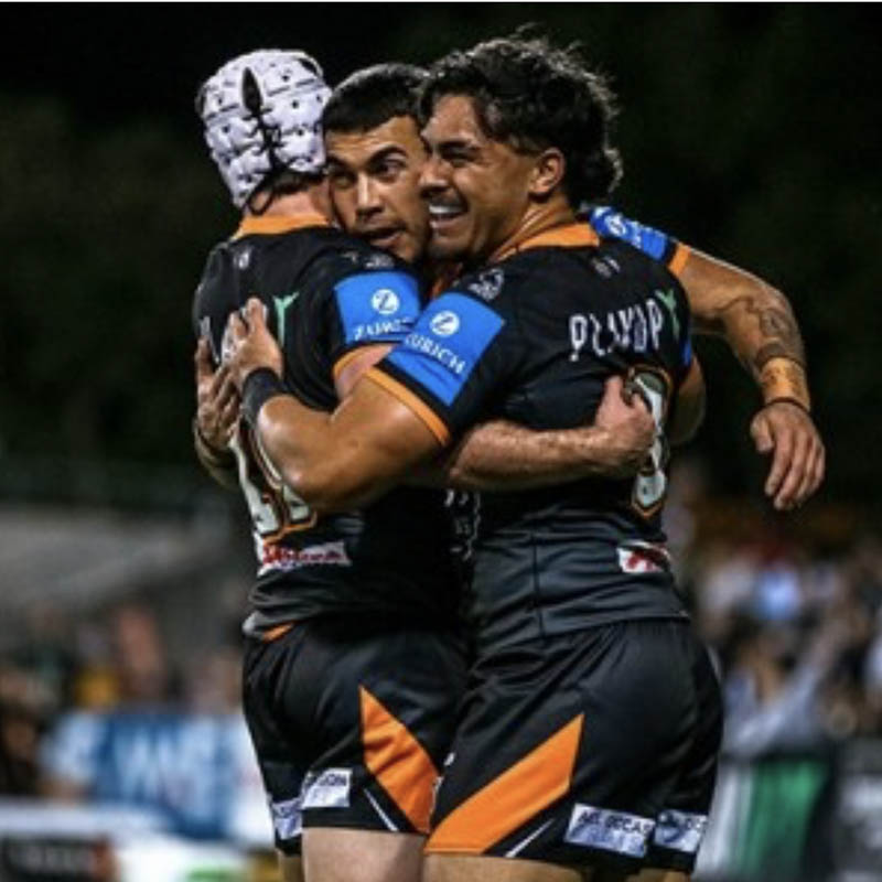 West Tigers team hugging