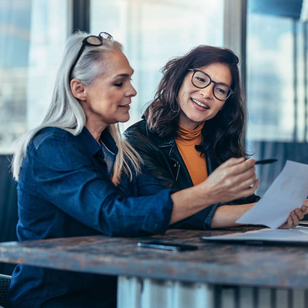 two women working together