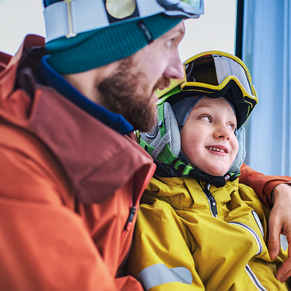 father and son in ski clothes