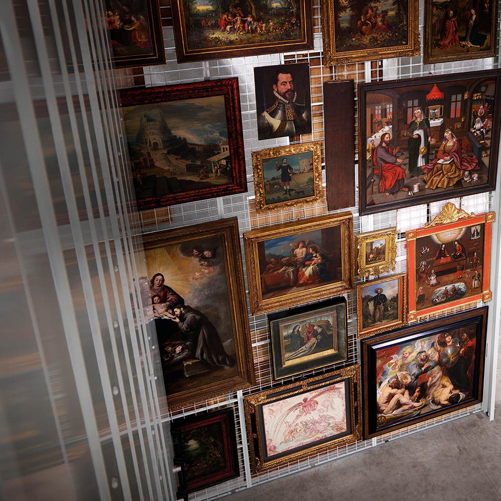 A wall full of paintings