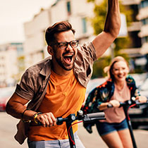 Happy people on scooter