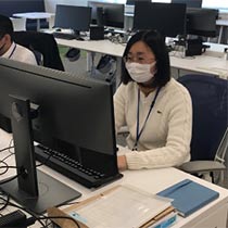 Woman working at a computer 