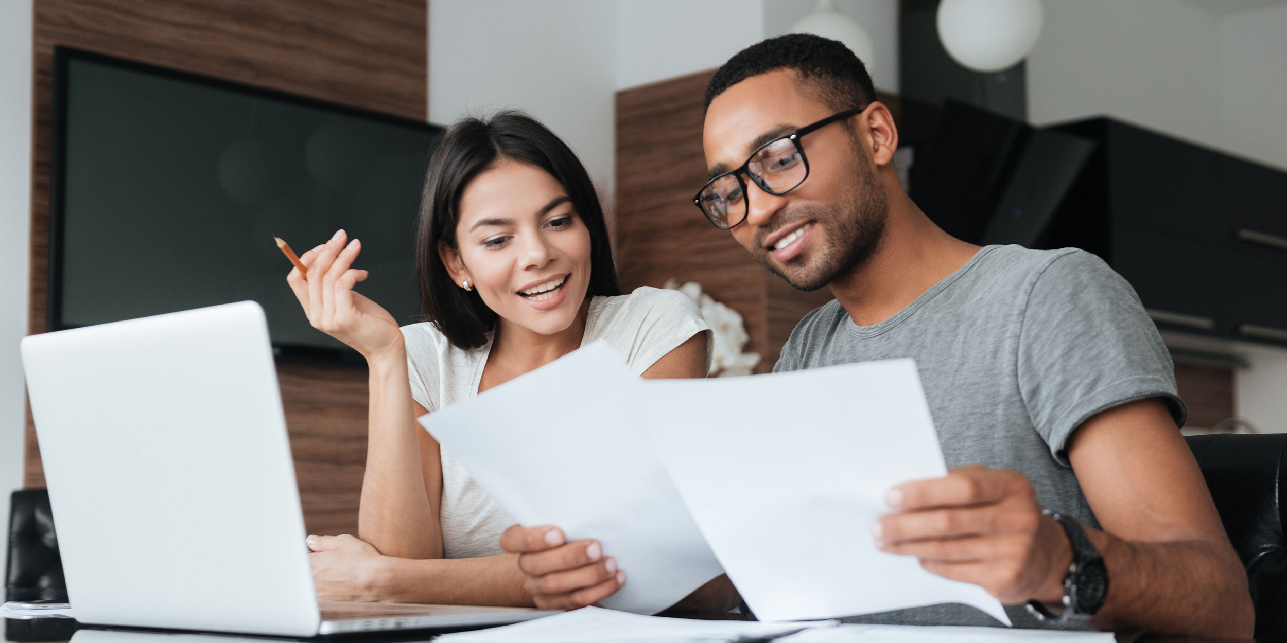 two people looking at documents together