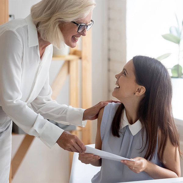 two women interacting