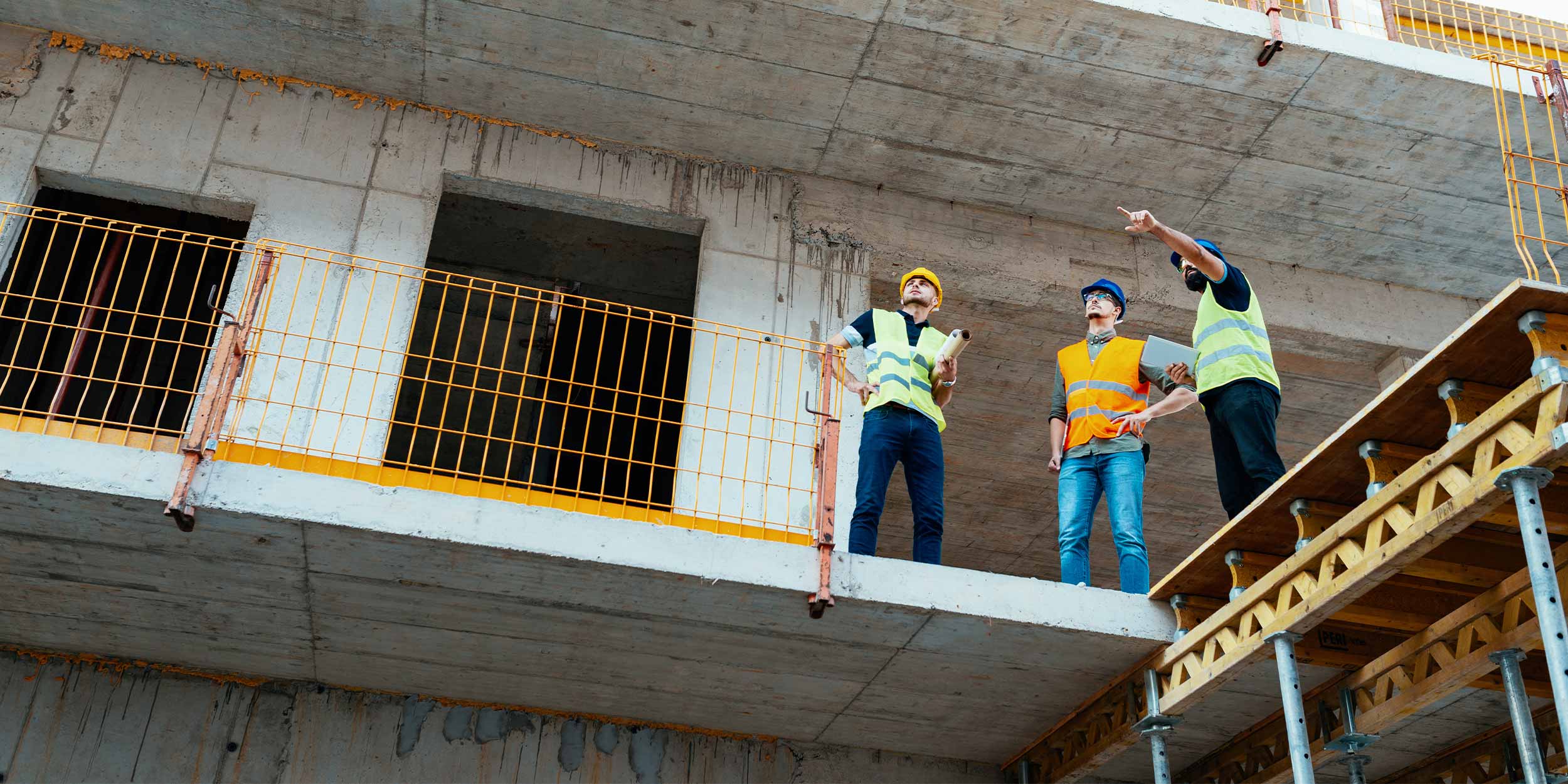 three engineers at a construction site