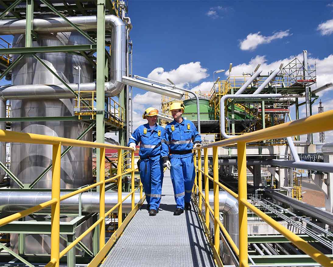 engineers walking on a bridge