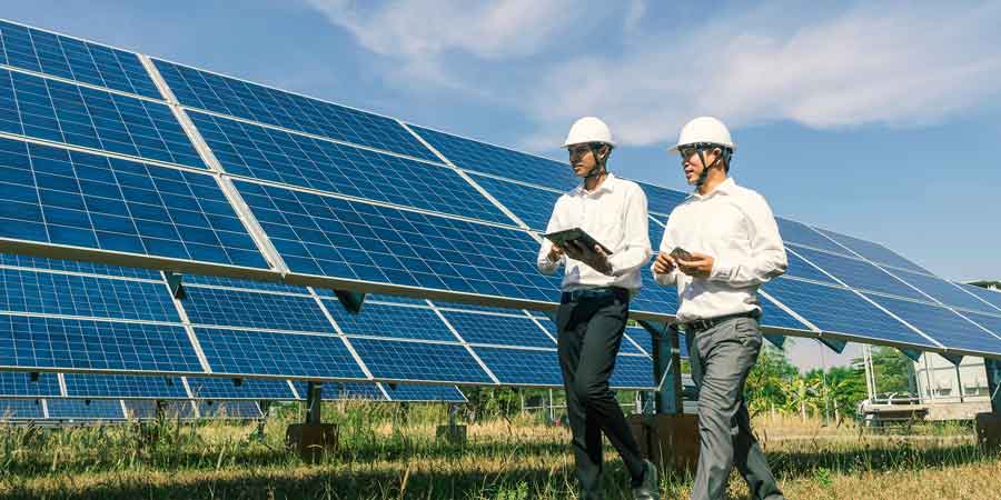 The solar farm with two engineers