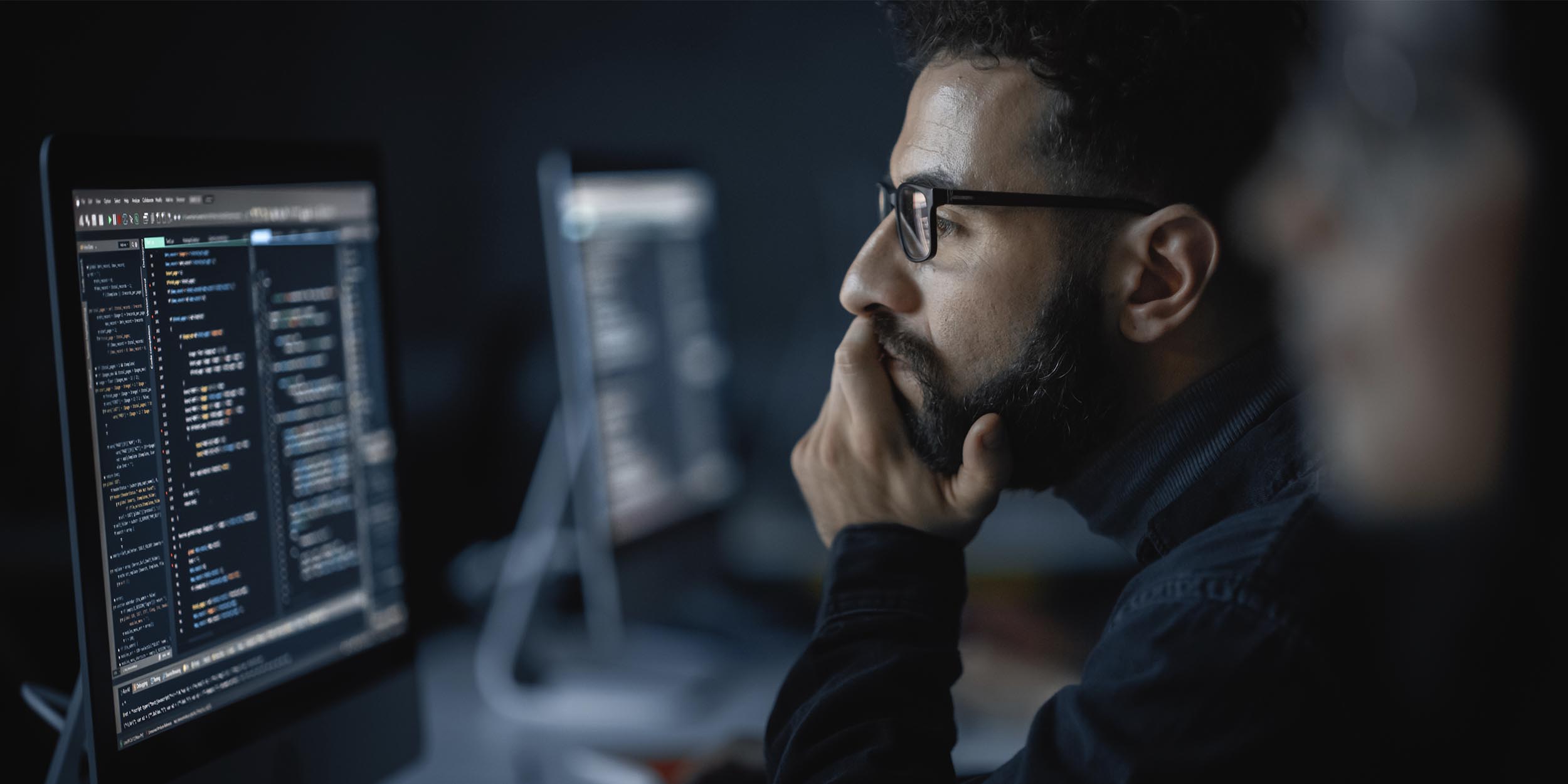 man looking at the screen
